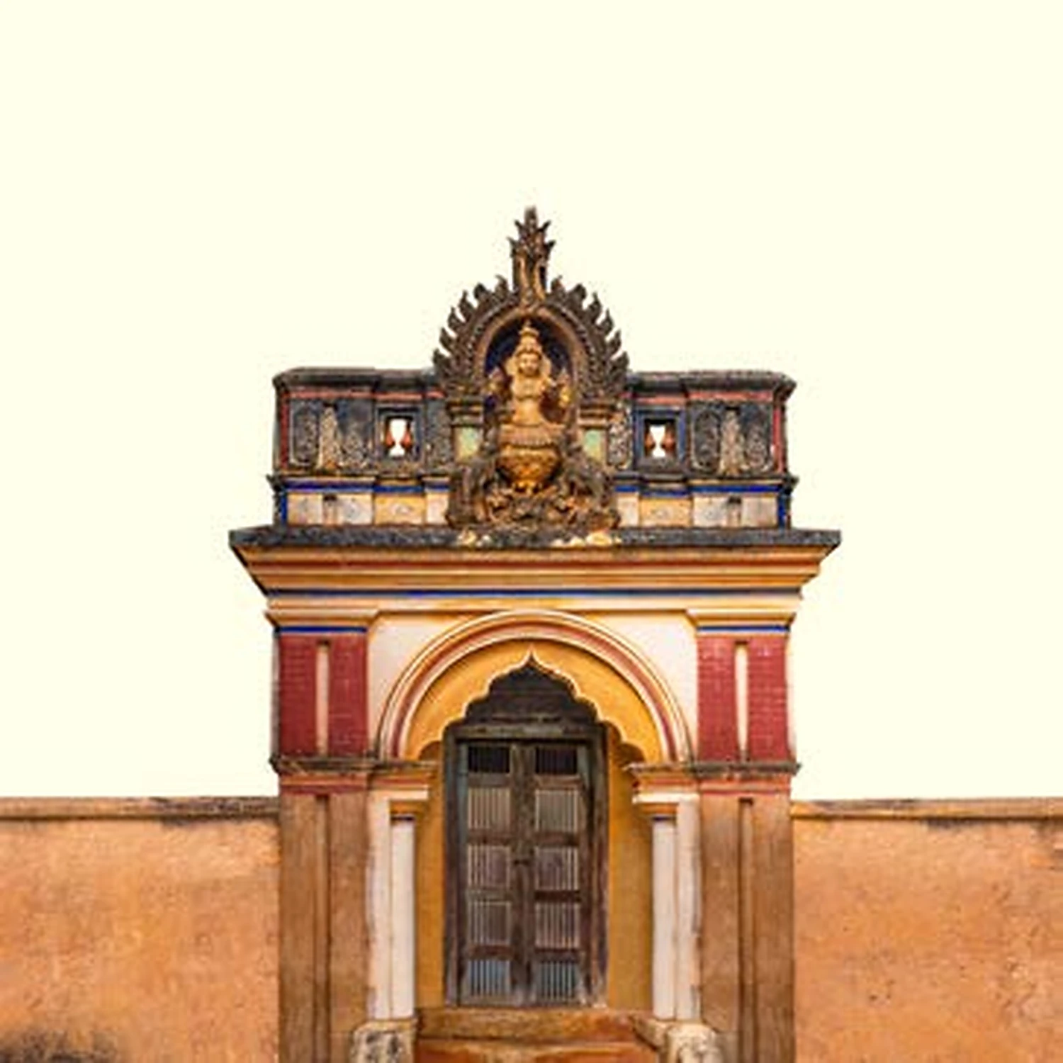 Ornate Mogappu entrance of a Chettinad mansion