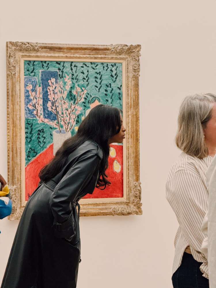 Curators Andile Magengelele and Dr. Raphaël Bouvier with artist Gina Jeanz in the galleries
