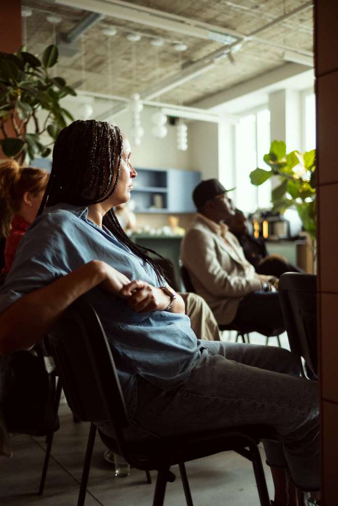 Guests listening at the salon