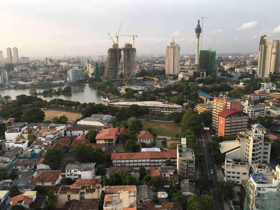 Colombo in 2016, cranes over Beira Lake and the Lotus Tower under construction