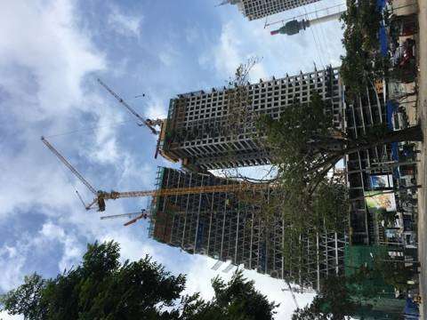 Twin towers under construction in Colombo, seen from street level