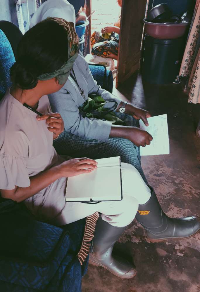 Tallulah Patricia Bär taking notes during an interview in the Ruvuma region, Tanzania