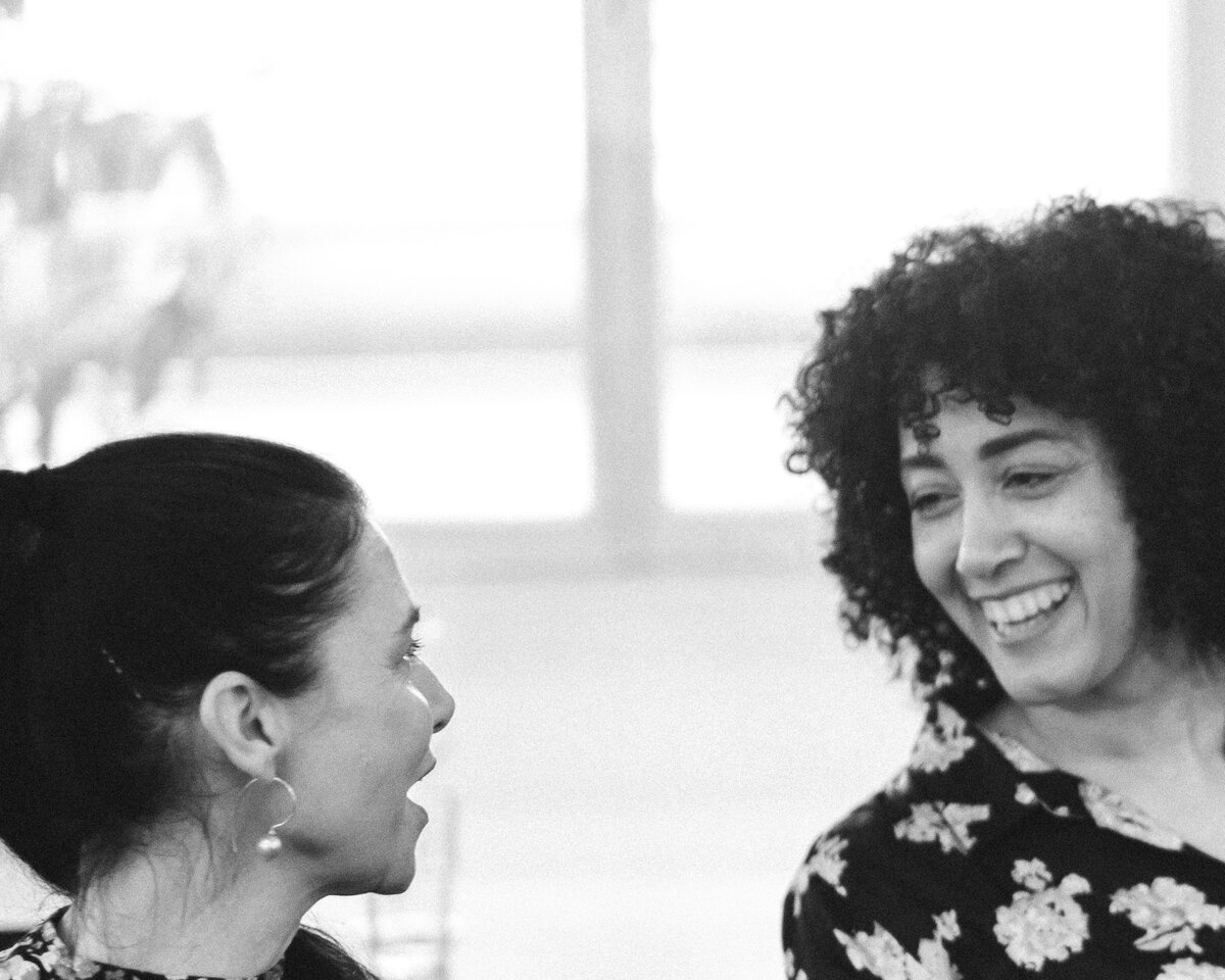 Two guests sharing a laugh during the evening