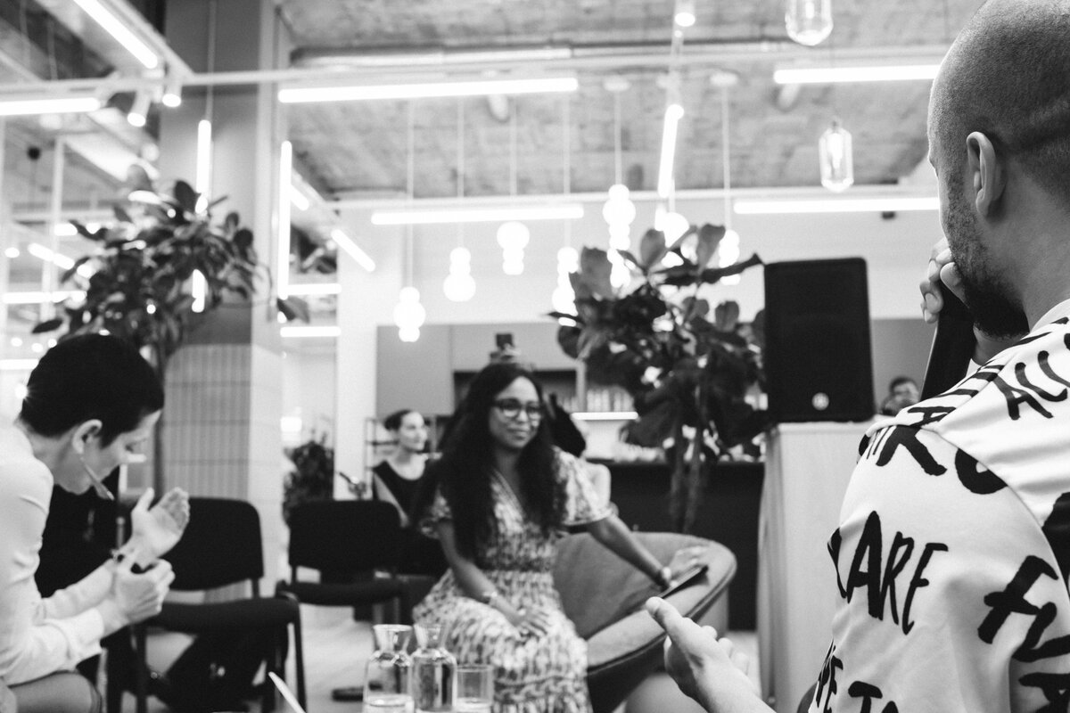 Black and white image of the room during an applause moment