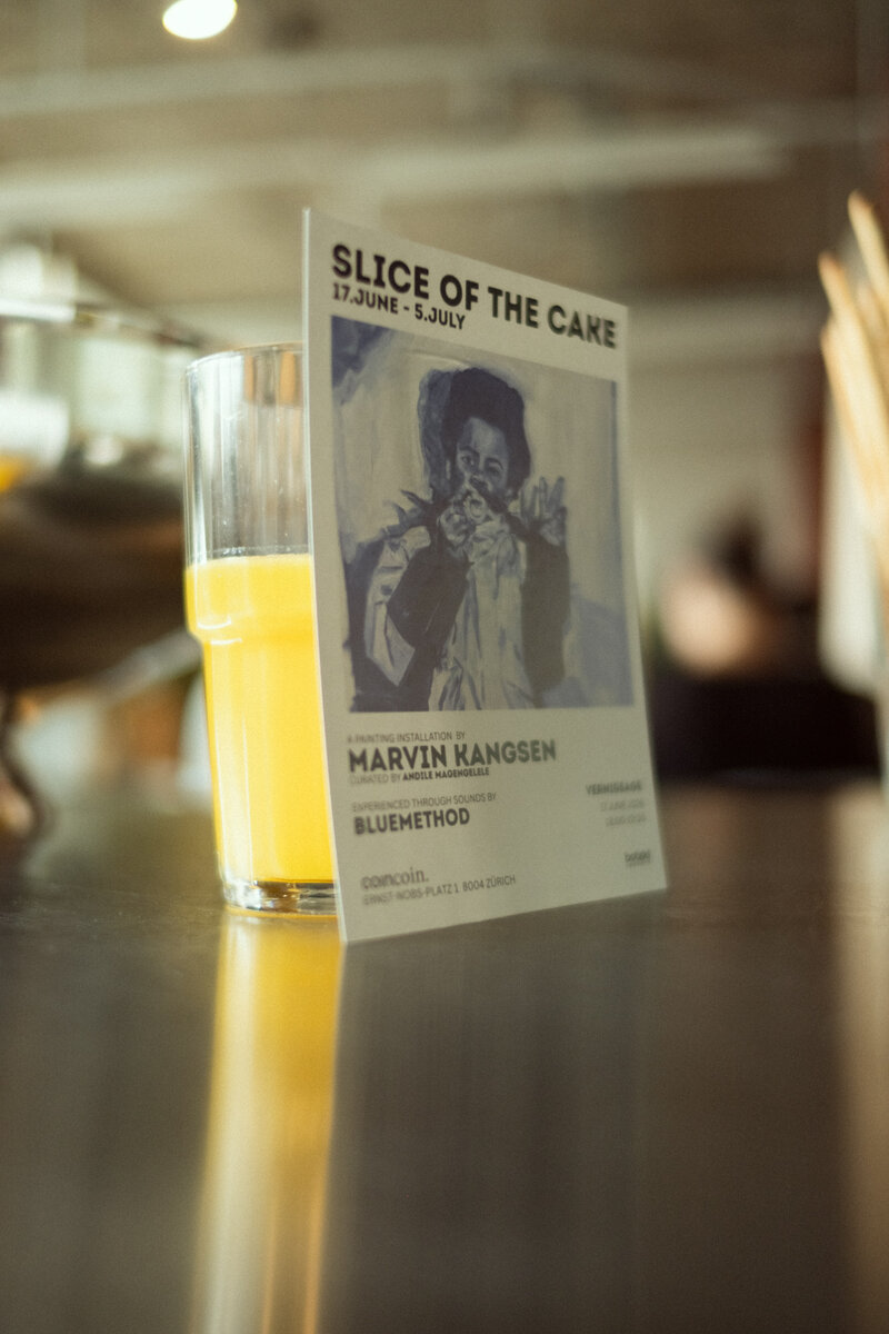 Slice of the Cake exhibition flyer standing on a table
